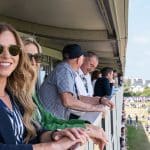 Fans enjoying views of the course from hospitality at The Open